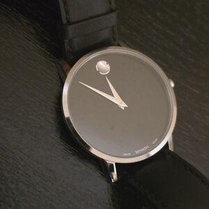 Movado Silver Dial Black Leather Watch 40MM. Slightly used.